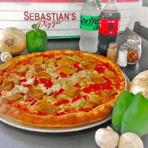 A delicious pizza with sausage, red peppers, and green bell peppers.