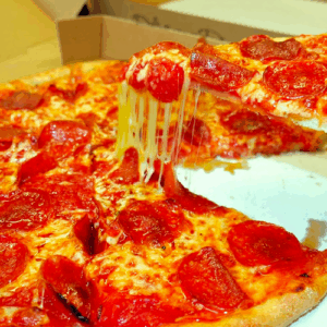 A slice of cheese and pepperoni pizza being lifted, cheese stretching.